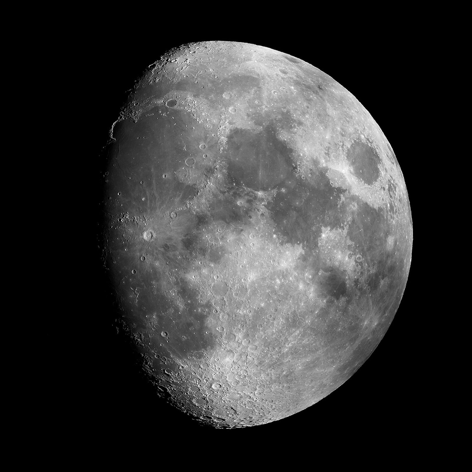 Gibbous Moon filling a square black frame with maria and rayed craters clearly visible.